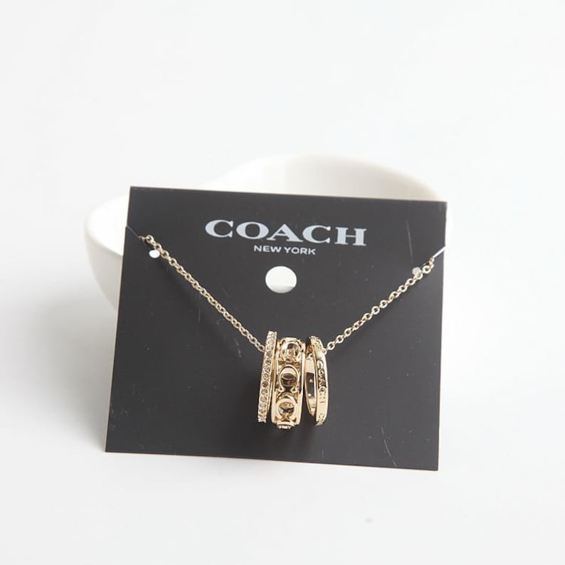 Coach Signature Metal Pendant Necklace In Gold With Dust Bag