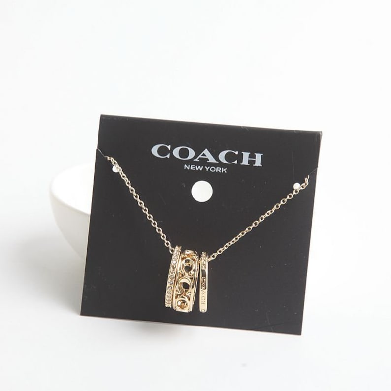 Coach Signature Metal Pendant Necklace In Gold With Dust Bag